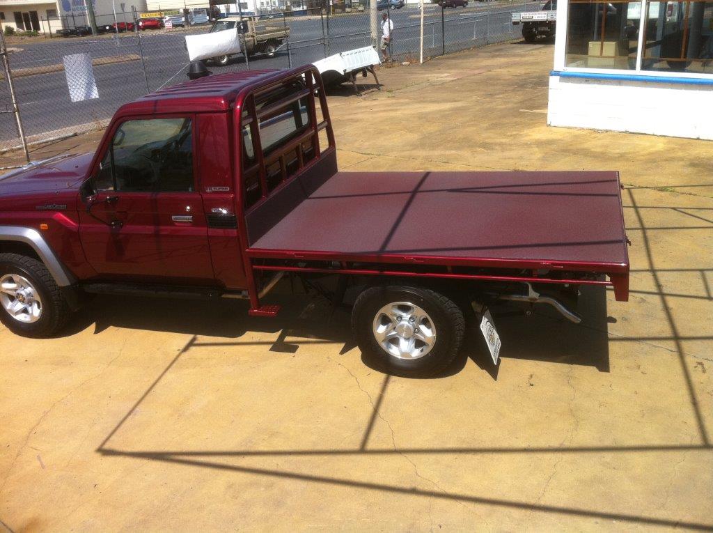 Speedliner® Spray In Bed Liner on Flatbed Truck in Custom Red - Match Custom Automotive Colors